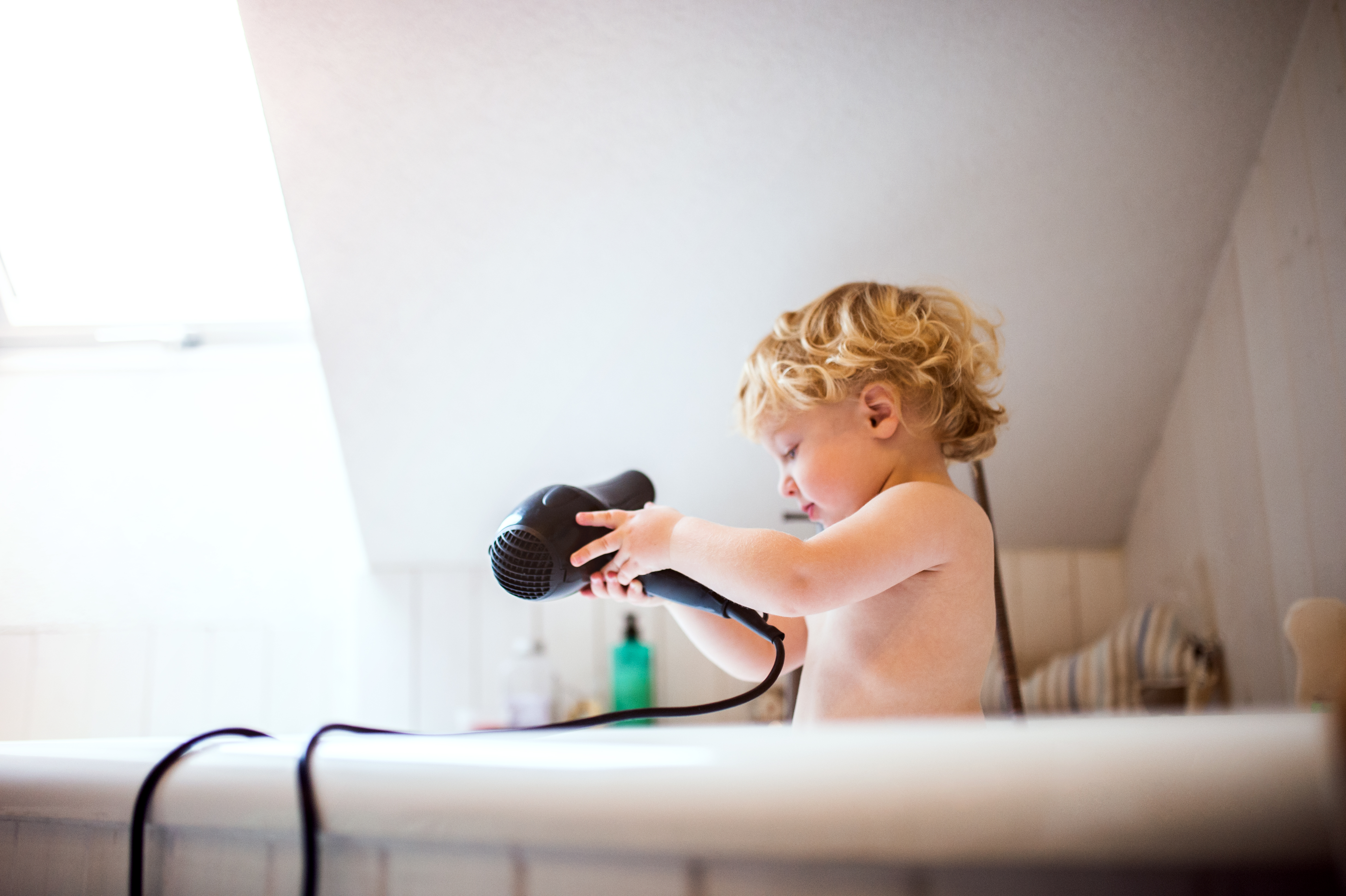 Child in Bath with Hairdryer